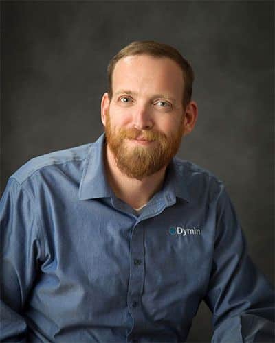 a man with a beard and blue shirt