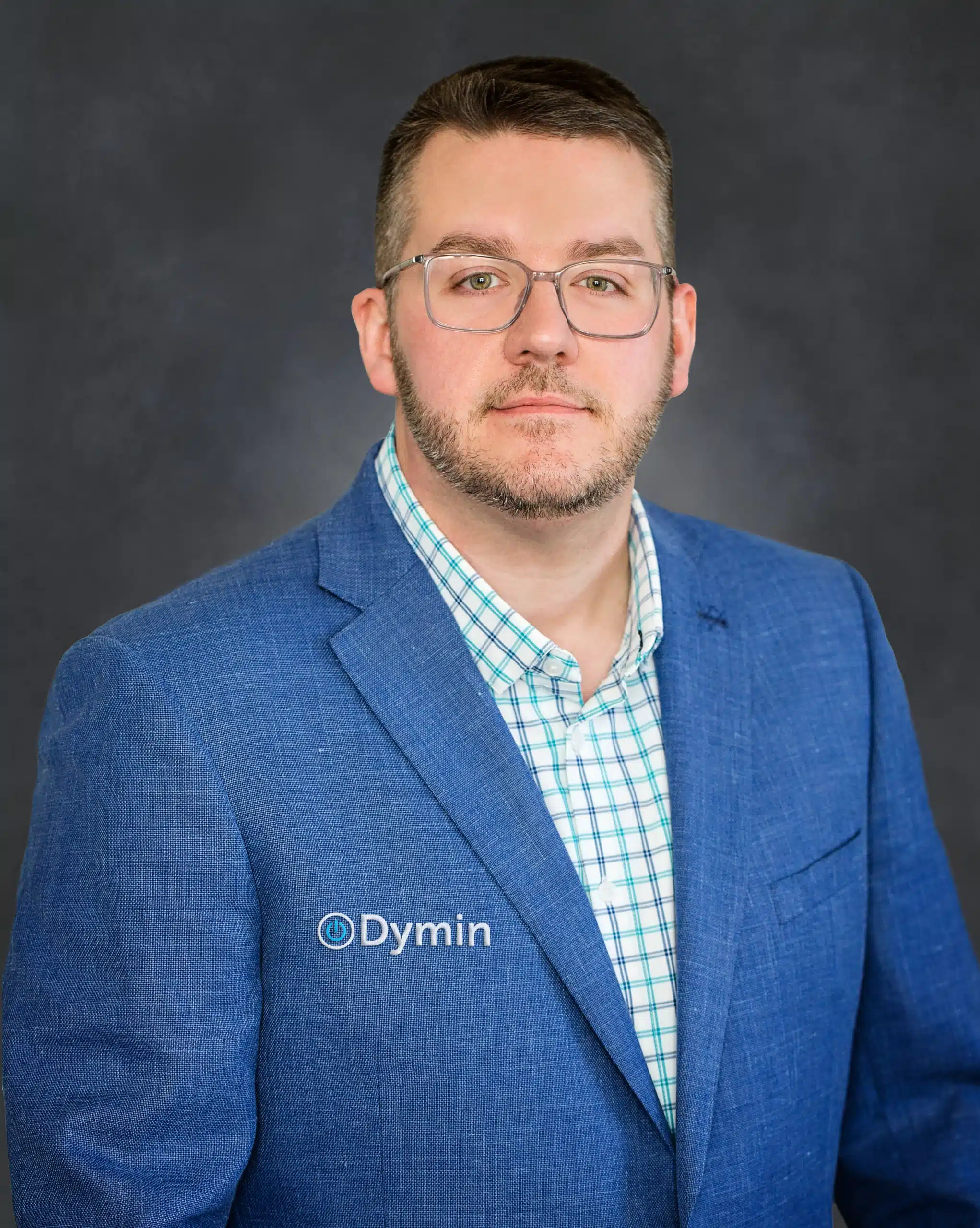 a man in a blue suit and glasses