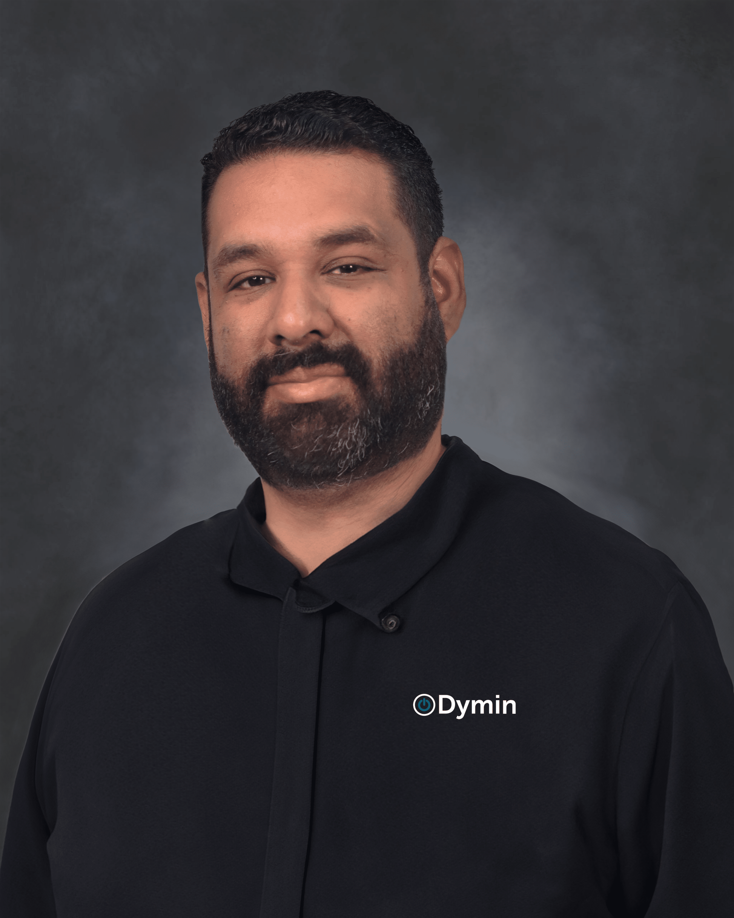 a man with a beard and black shirt