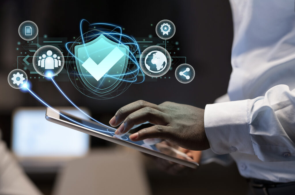 a man holding a tablet with icons coming out of it