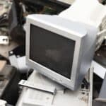 a pile of old computers and other electronic equipment