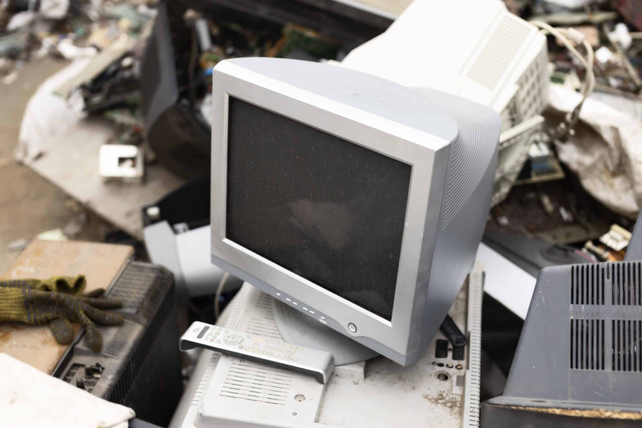 a pile of old computers and other electronic equipment