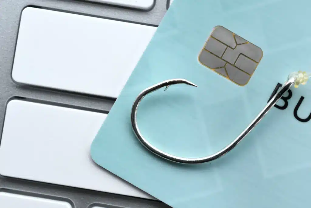 a credit card sitting on top of a computer keyboard