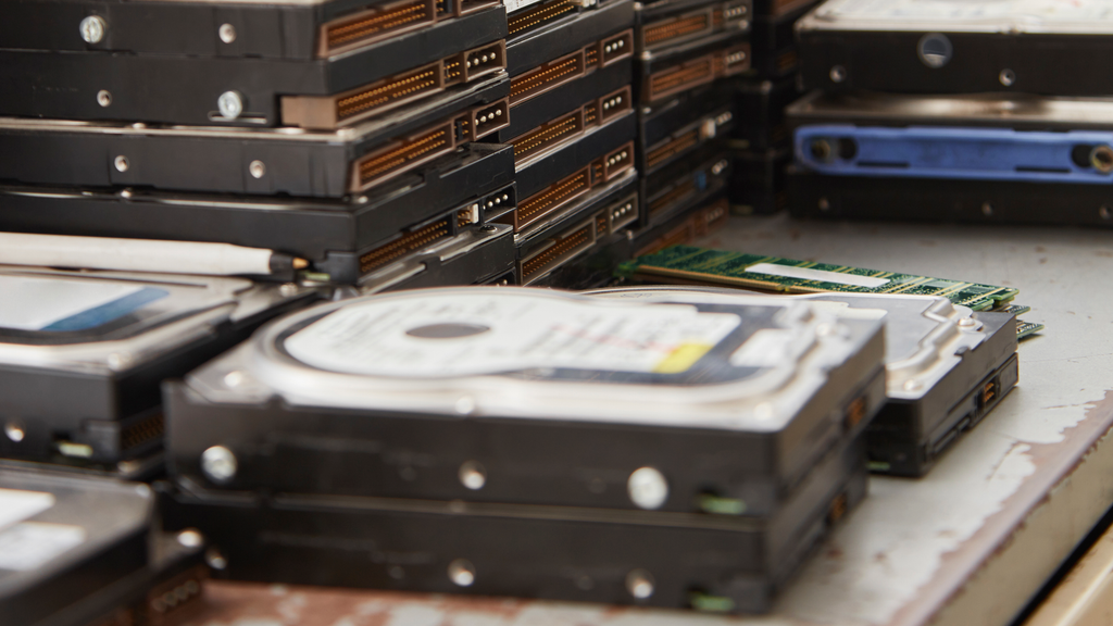 a pile of hard drives sitting on top of a table