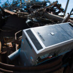 a microwave sitting on top of a pile of junk