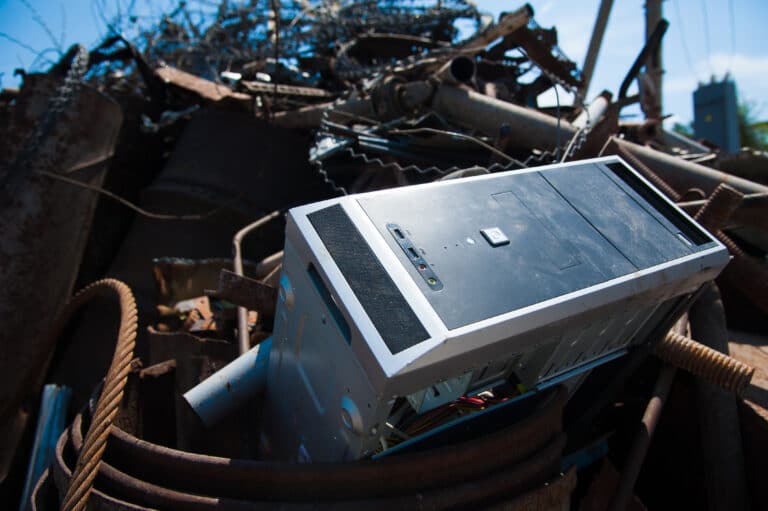 a microwave sitting on top of a pile of junk