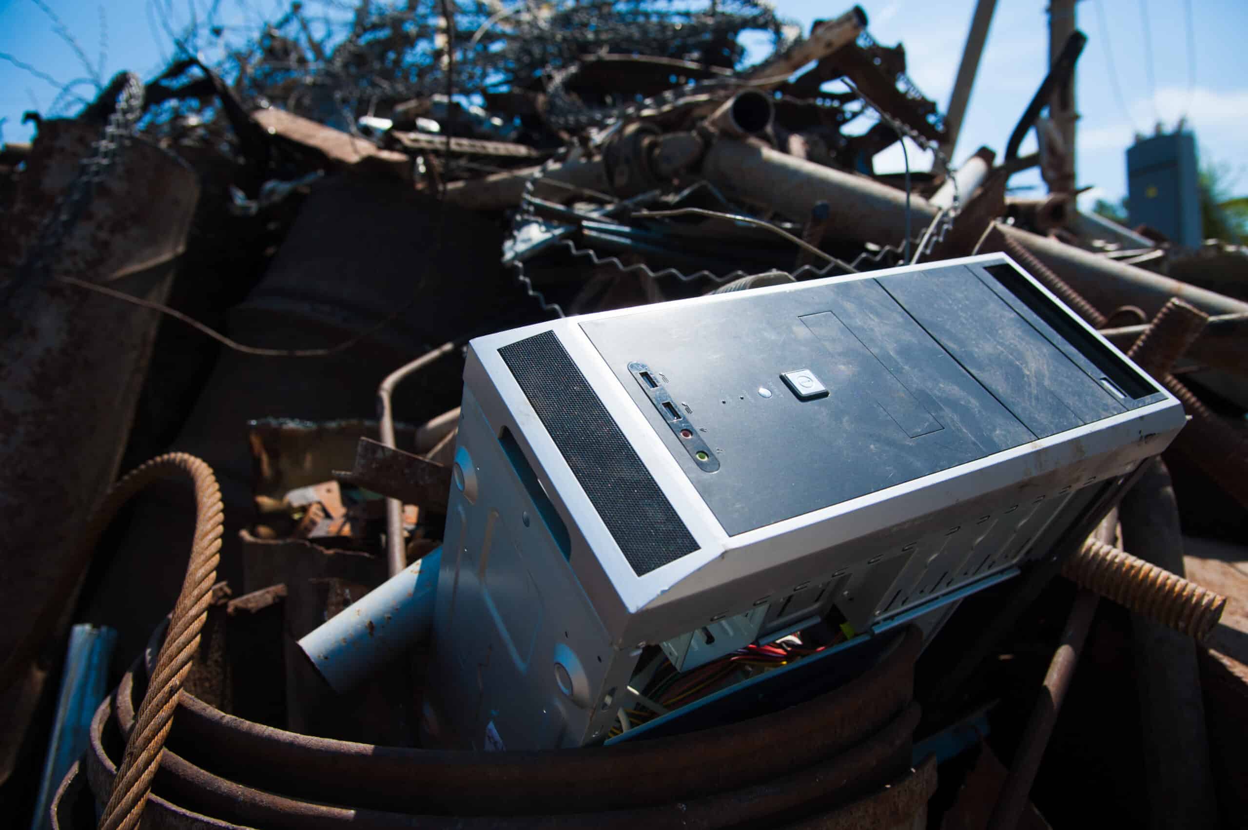 a microwave sitting on top of a pile of junk